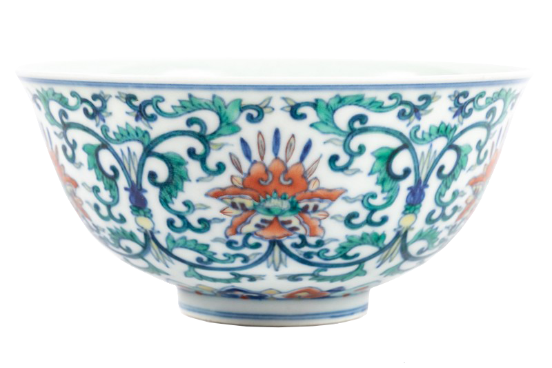 A Chinese doucai porcelain bowl in blue, green, and orange with yellow accents. 